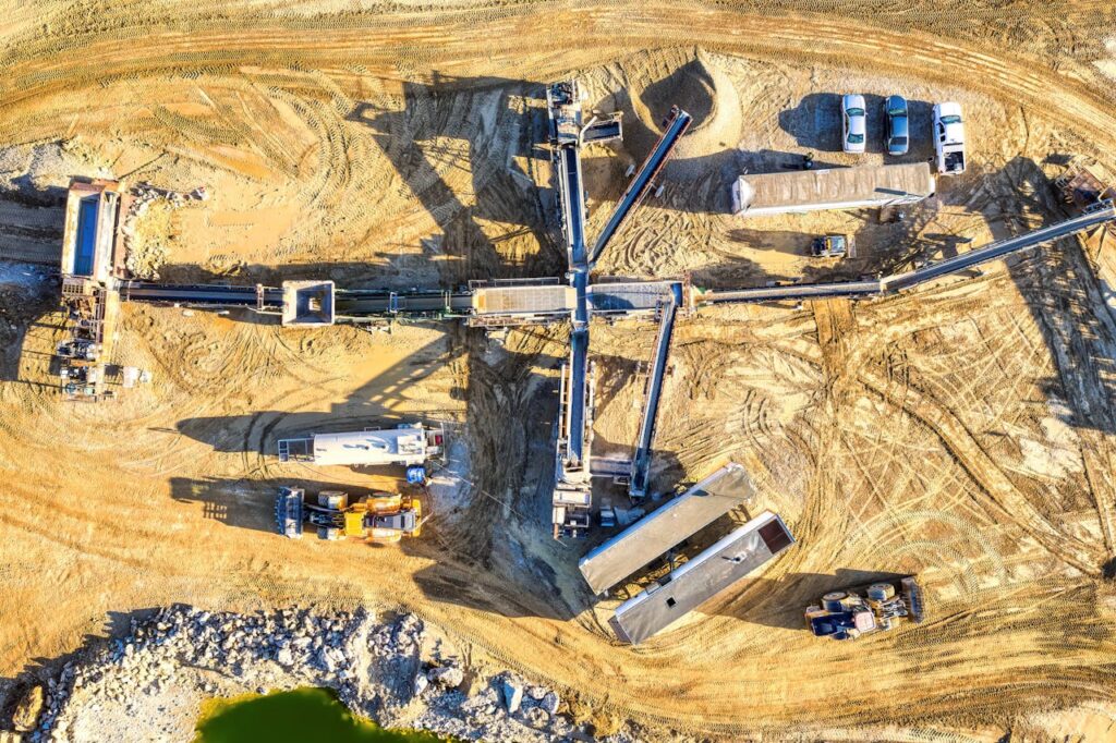 Drone capture of an industrial mining site in Rochester, showcasing heavy machinery and equipment.